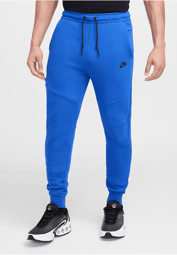 NIKE Tapered Pants in Royal Blue