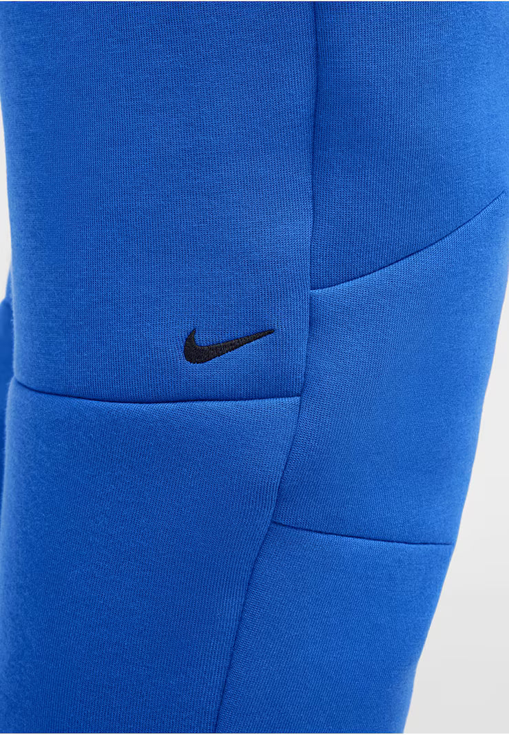 NIKE Tapered Pants in Royal Blue