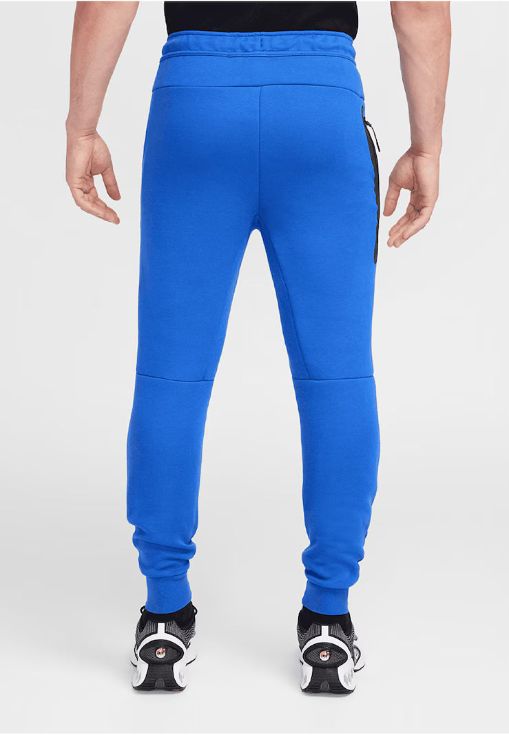NIKE Tapered Pants in Royal Blue
